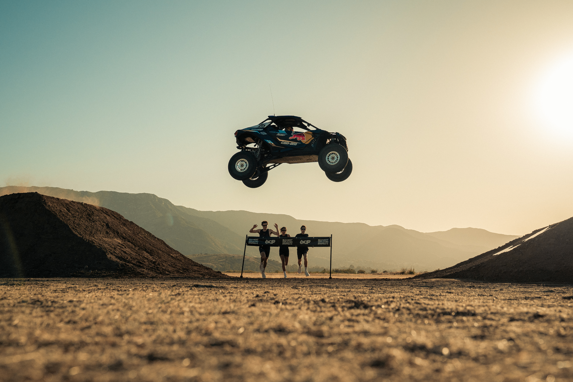 Can-Am buggy launching over runners at the Bandit Grand Prix